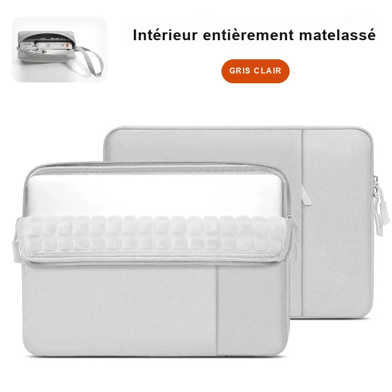 Housse gris clair ouverte sur sa doublure matelassée, avec une petite trousse d'accessoires en médaillon.