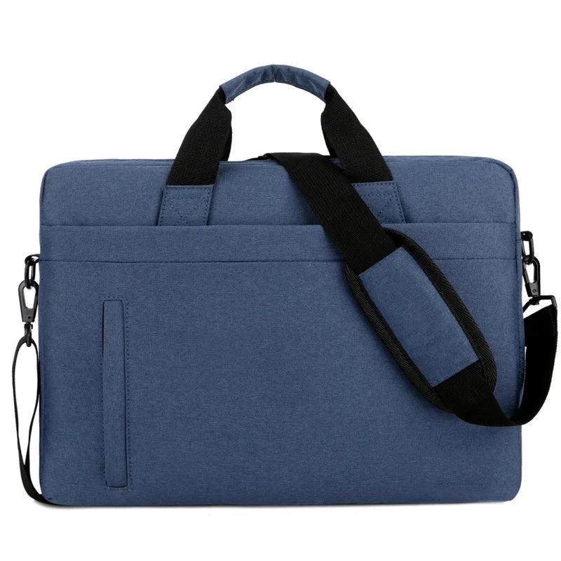 Sacoche bleu marine pour ordinateur portable avec poignée noire rembourrée et bandoulière réglable, posée à plat sur fond blanc.