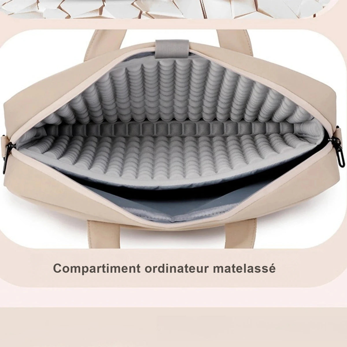 Housse ordinateur creme ouverte, montrant la doublure grise matelassee a bulles du compartiment.