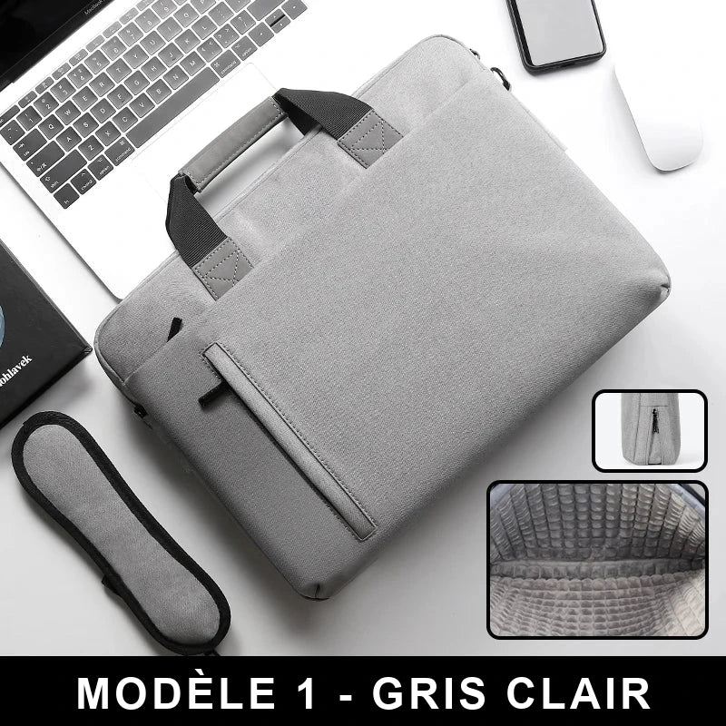 Sacoche pour ordinateur portable en nylon gris clair, poignée et poche avant zippée, posée sur un bureau avec un ordinateur portable et un téléphone ; vignette de l'intérieur compartimenté.